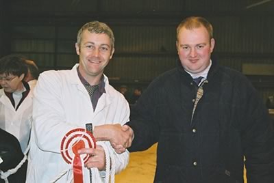 Commercial Judge Neil Slack Penrith presenting Commercial Champion winner Frank Page, Northampton